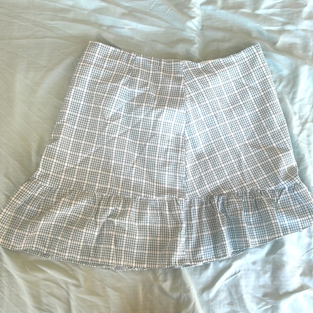 Green and white skirt with ruffles. Size medium.